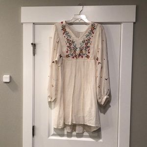 Cream embroidered mini dress.